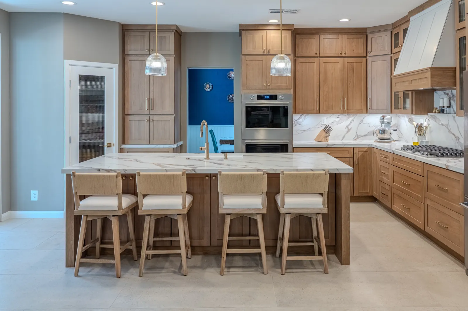 Oak cabinets with full-height stone