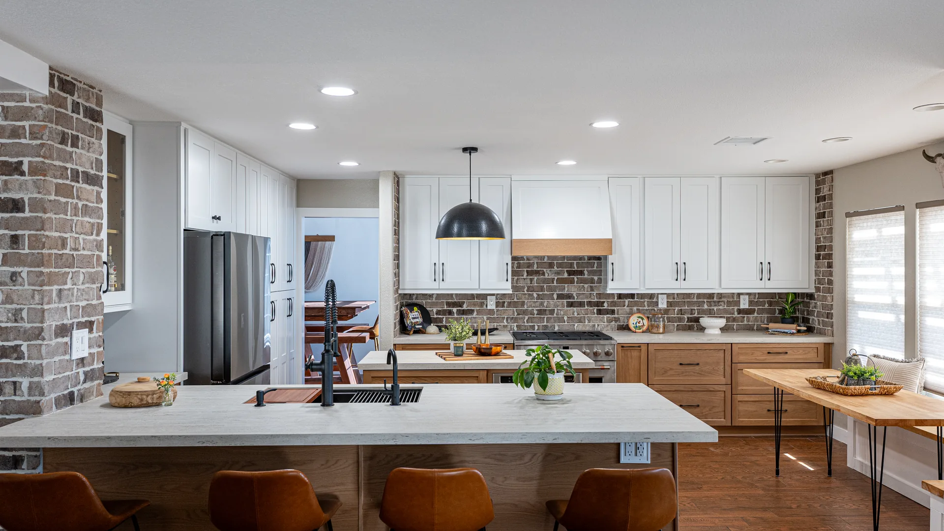 Finished Pacific Stone kitchen with stone countertops and a full-height backsplash