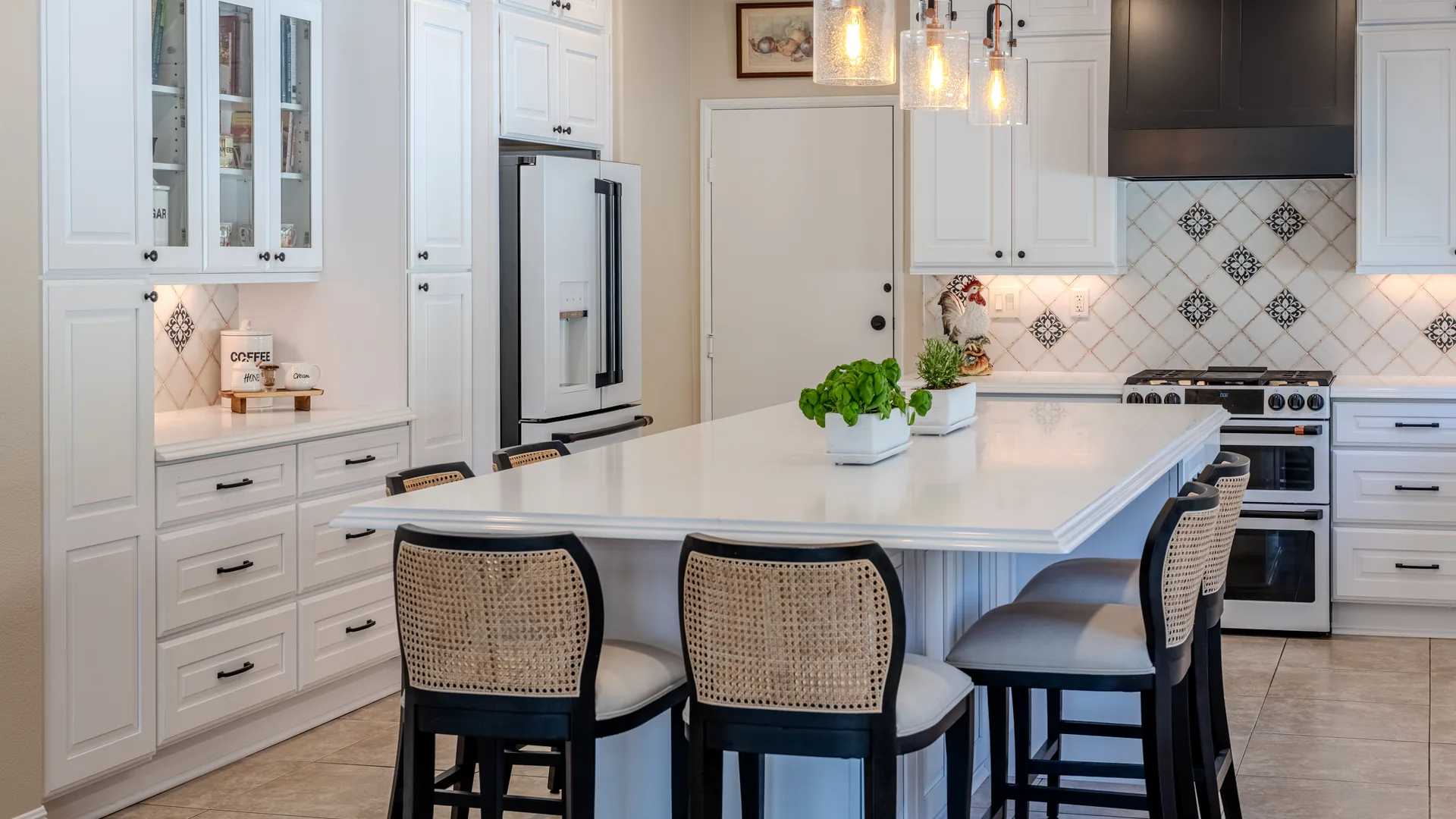 Finished Pacific Stone kitchen with coordinated cabinetry, countertops, and backsplash