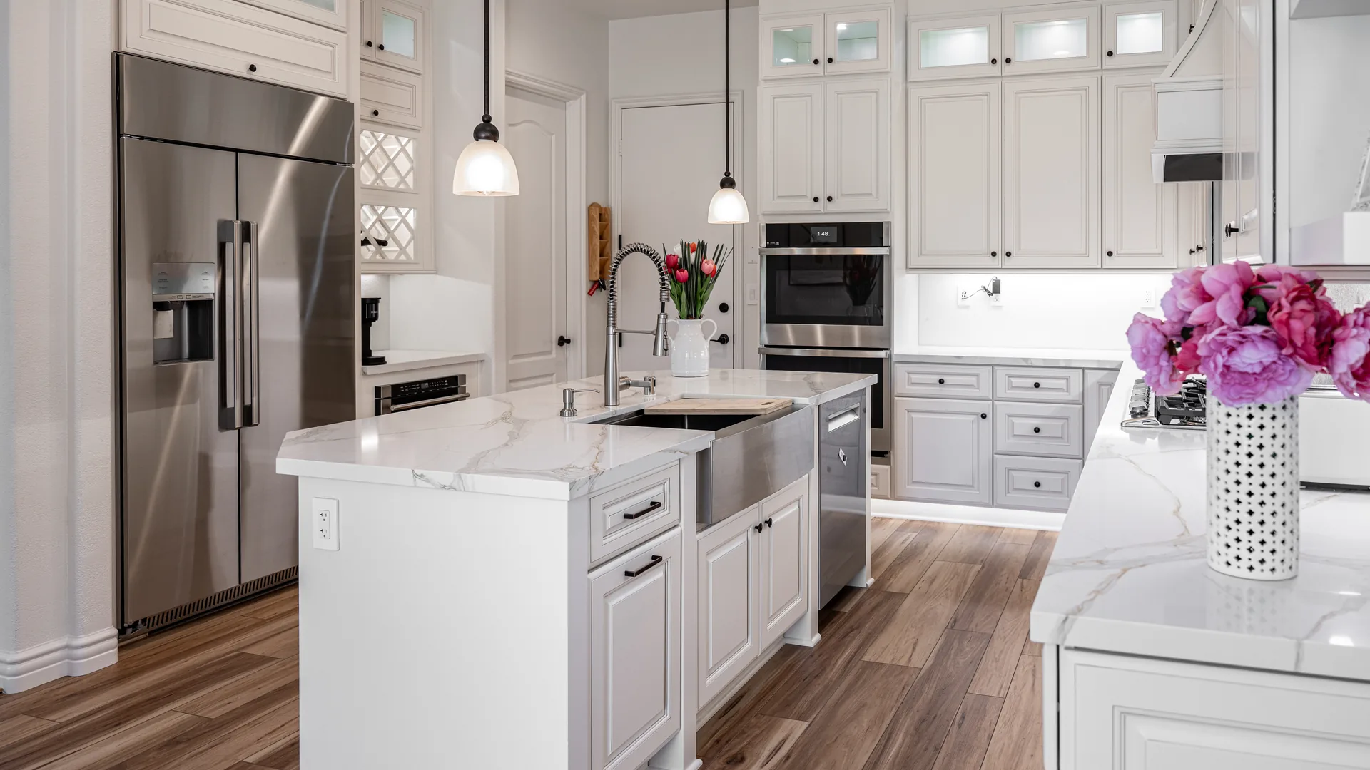 Finished Pacific Stone kitchen with stone countertops and a full-height backsplash