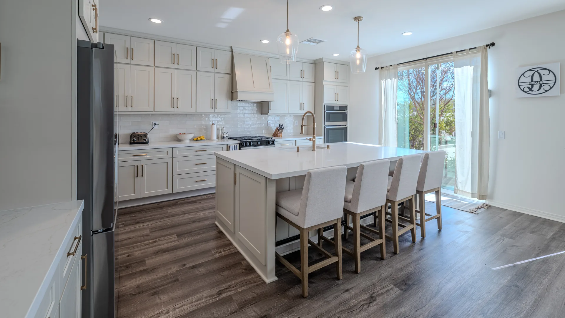 Finished Pacific Stone kitchen with coordinated cabinetry, countertops, and backsplash