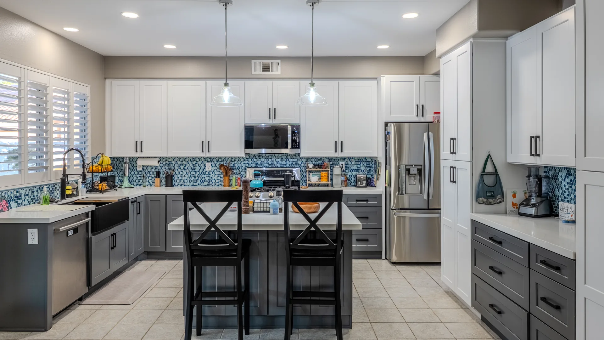 Finished Pacific Stone kitchen with coordinated cabinetry, countertops, and backsplash