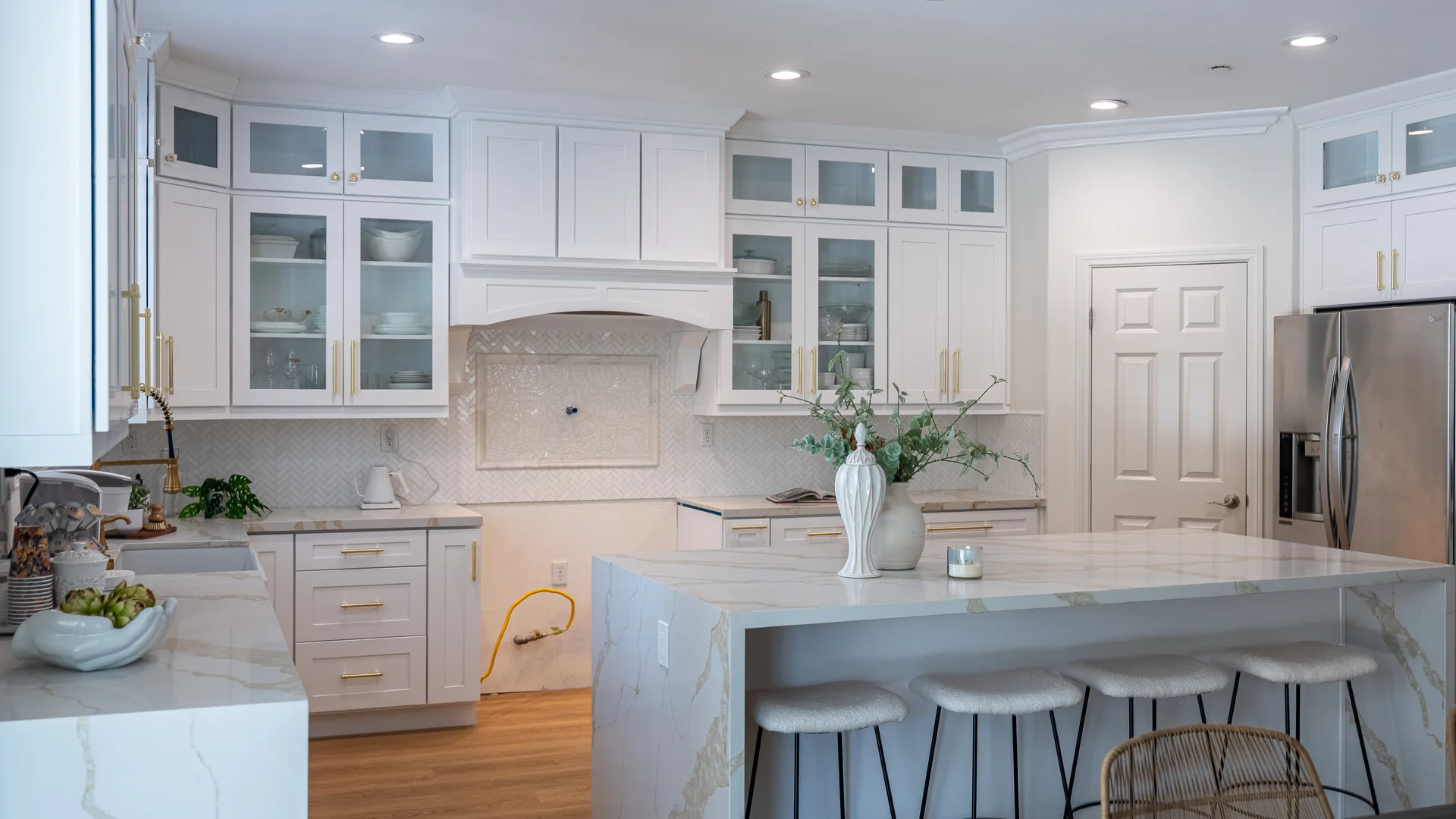 Finished Pacific Stone kitchen with stone countertops and a full-height backsplash