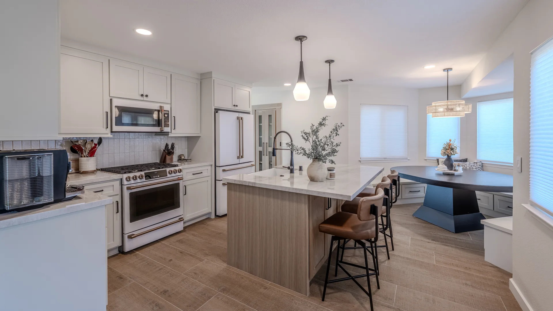 Finished Pacific Stone kitchen with custom cabinetry and integrated storage