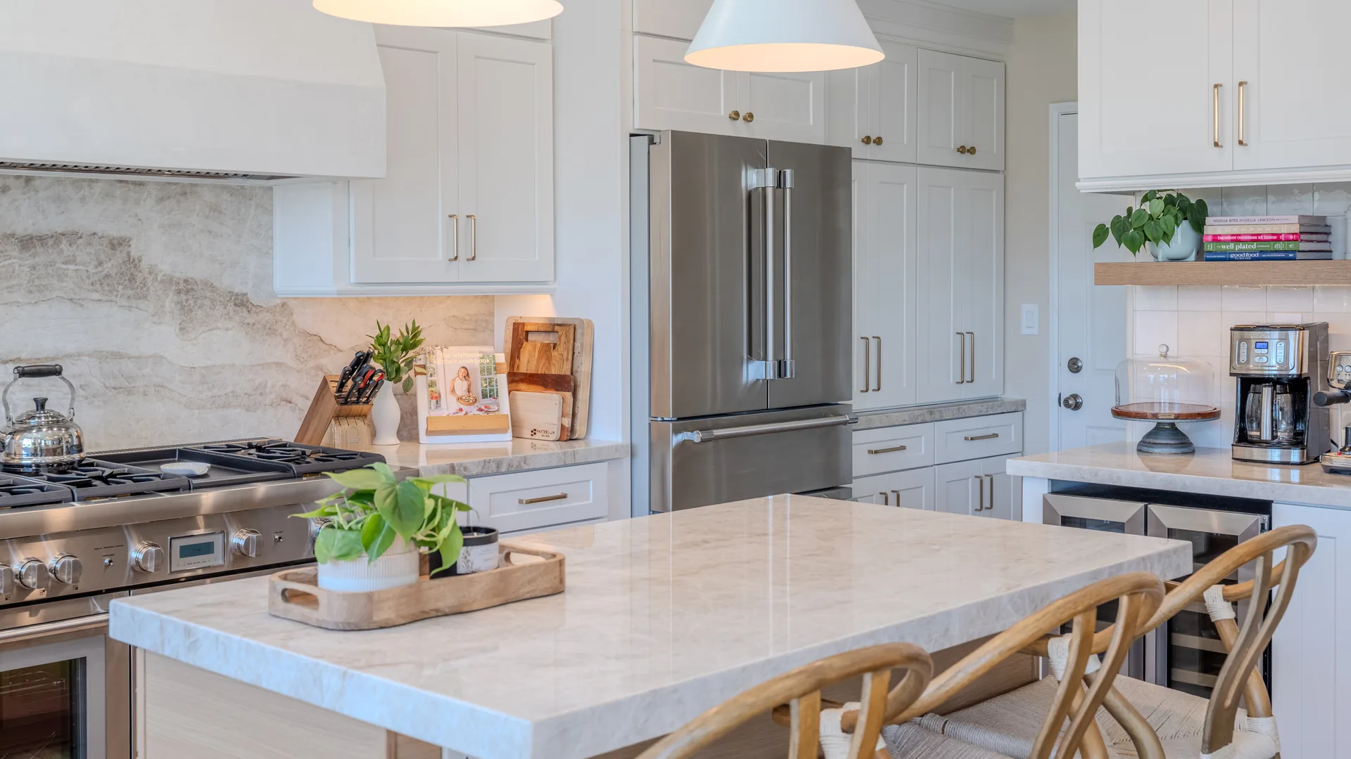 Finished Pacific Stone kitchen with stone countertops and a full-height backsplash