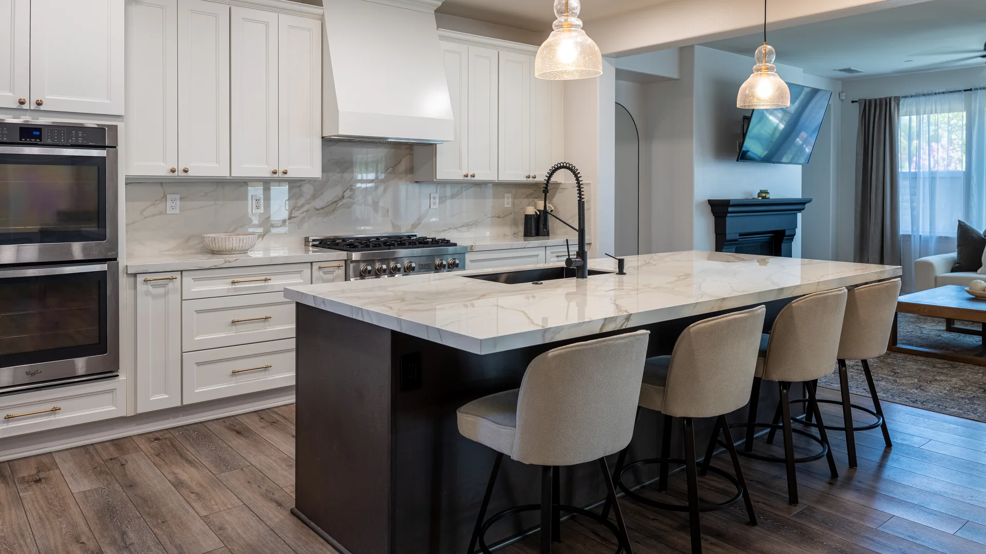 Finished Pacific Stone kitchen with stone countertops and a full-height backsplash