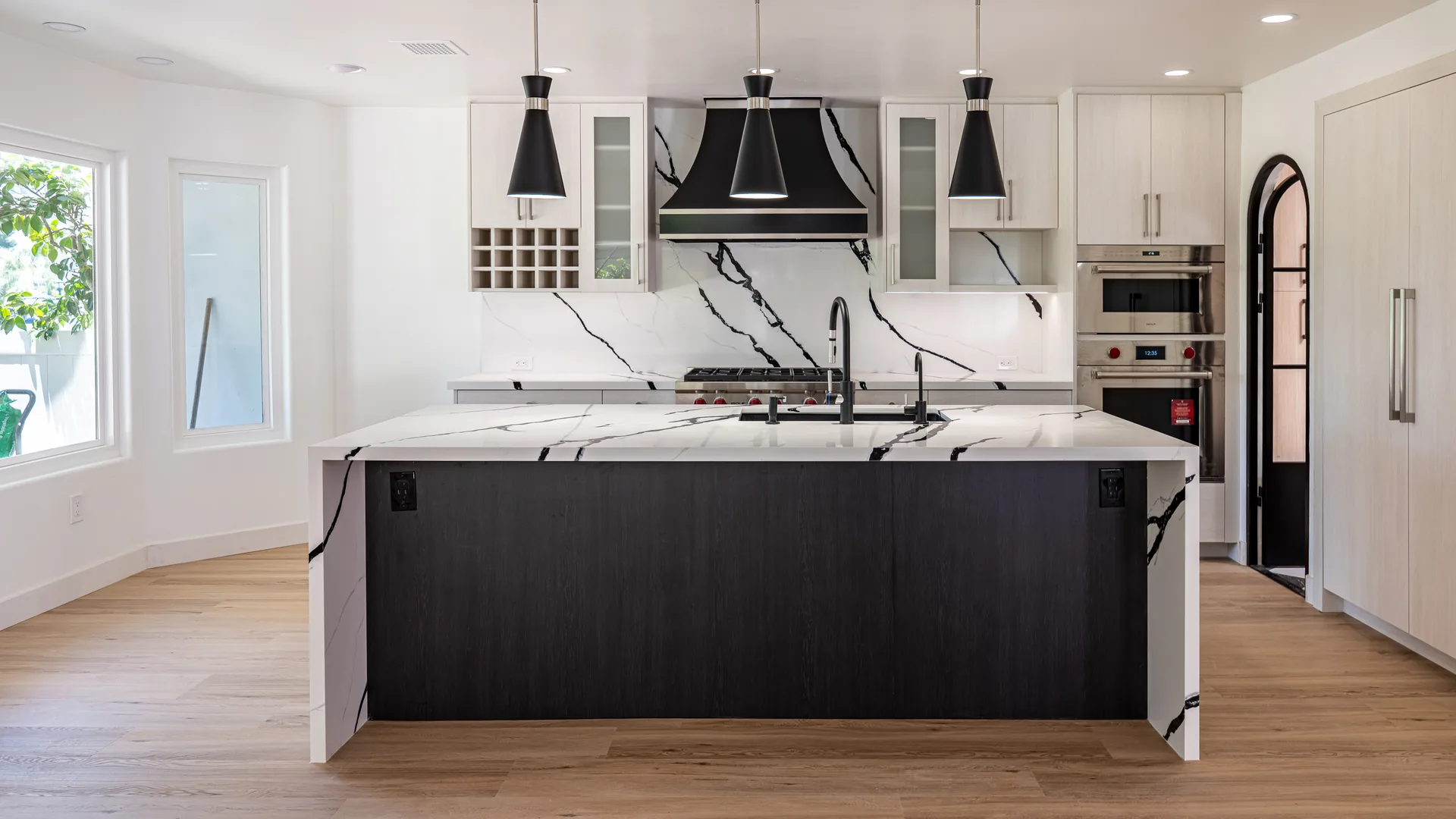 Finished Pacific Stone kitchen with custom cabinetry and integrated storage