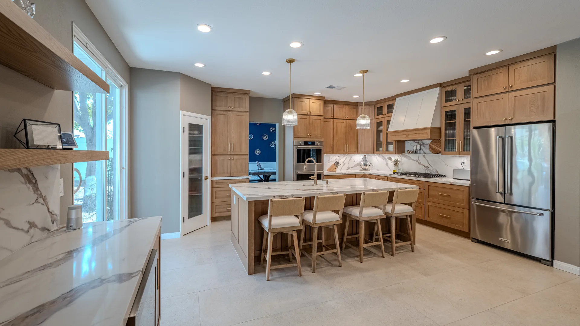 Finished Pacific Stone kitchen with coordinated cabinets and stone surfaces