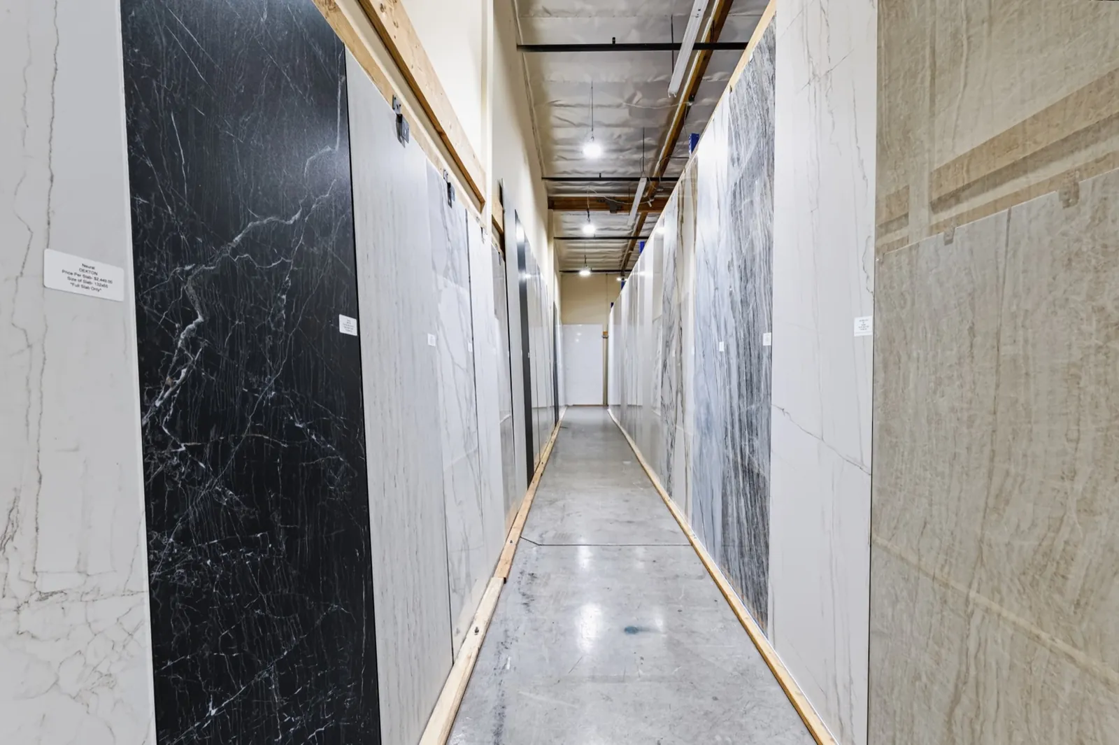 Manufactured countertop slabs displayed inside the San Clemente showroom