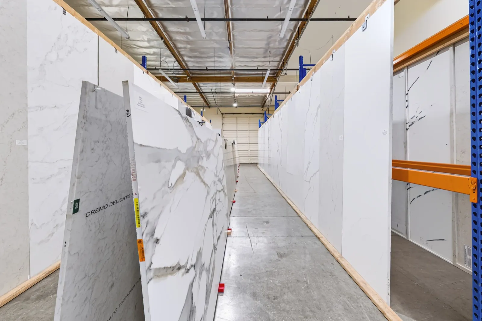 Wide view of manufactured countertop slabs inside the San Clemente showroom