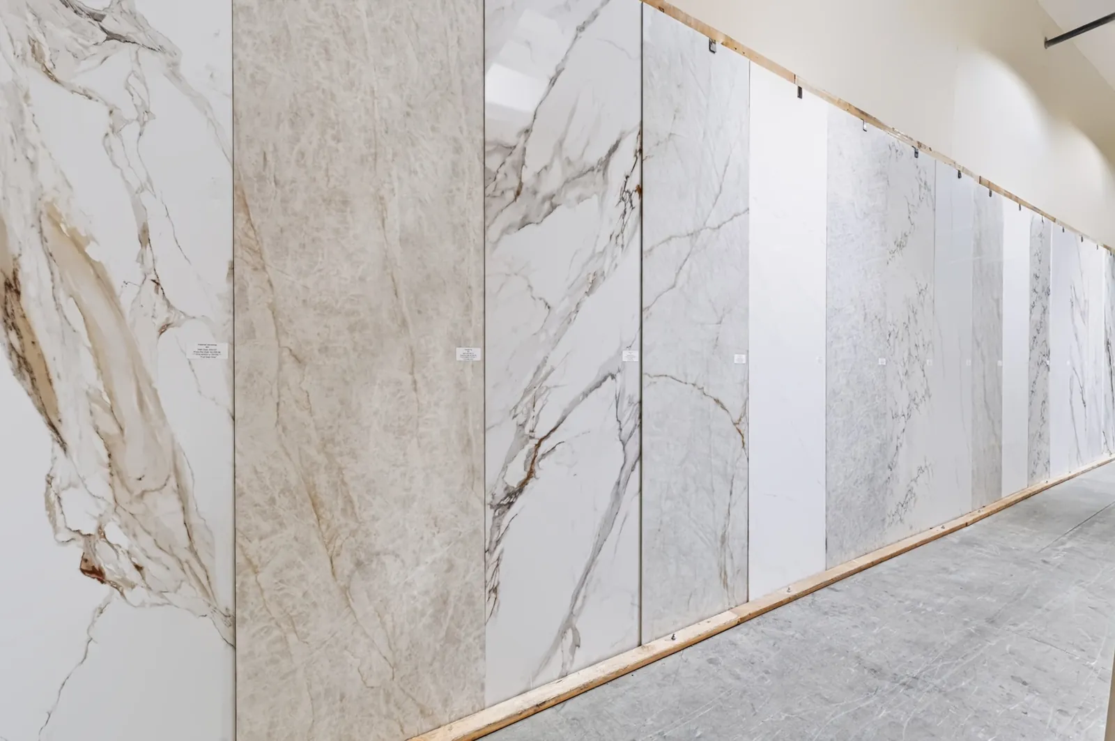 Wall of manufactured countertop slabs in the San Clemente showroom