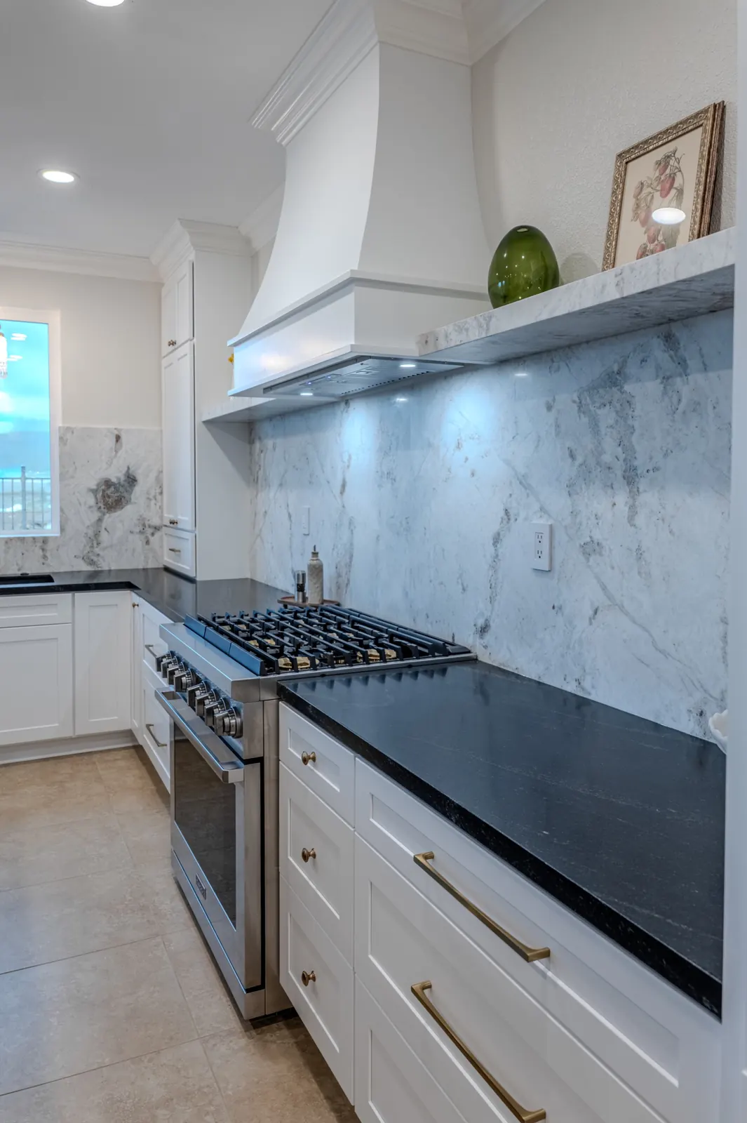 Full-height stone backsplash with contrasting countertop