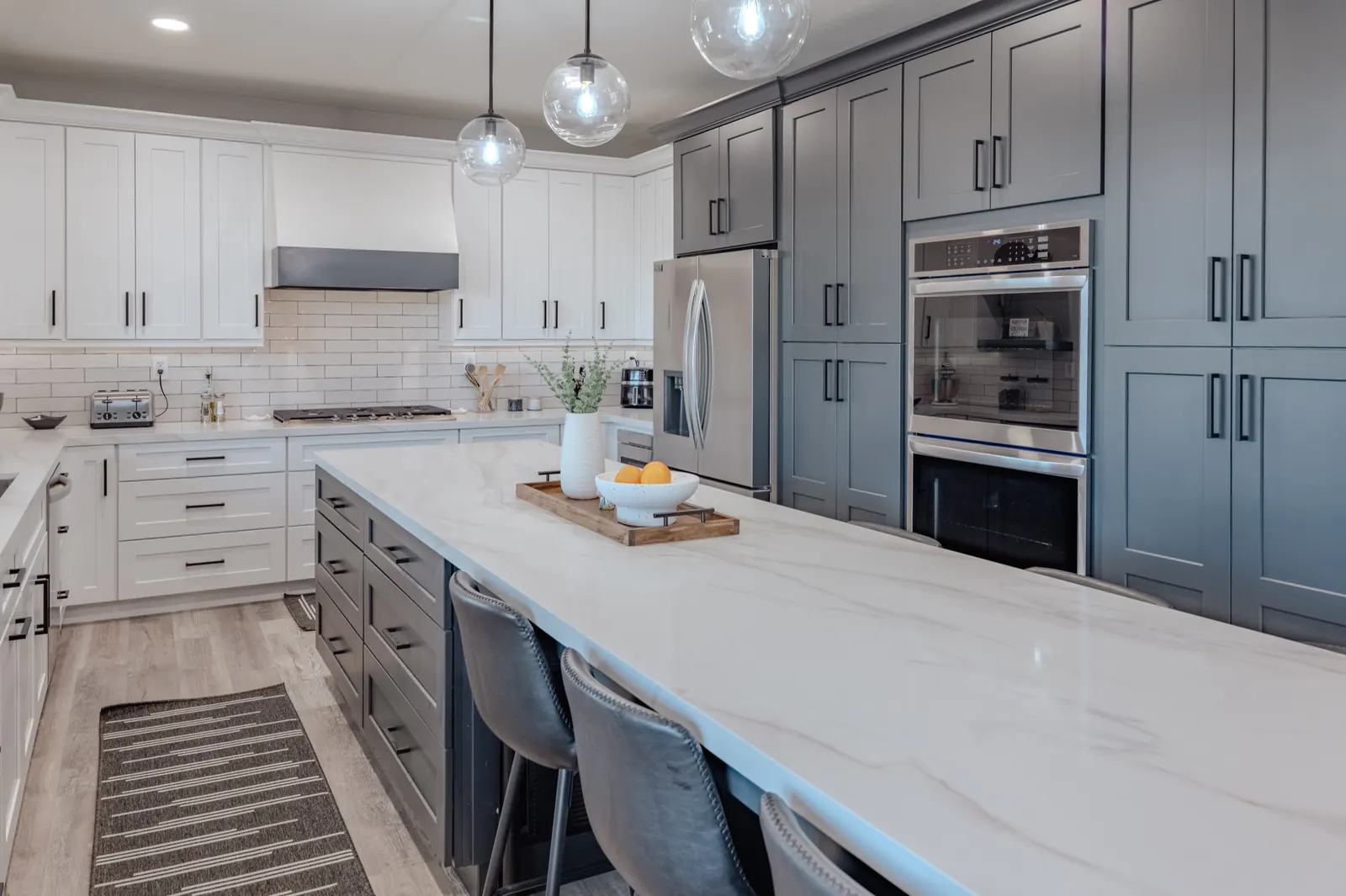 Two-tone cabinet kitchen with a large island