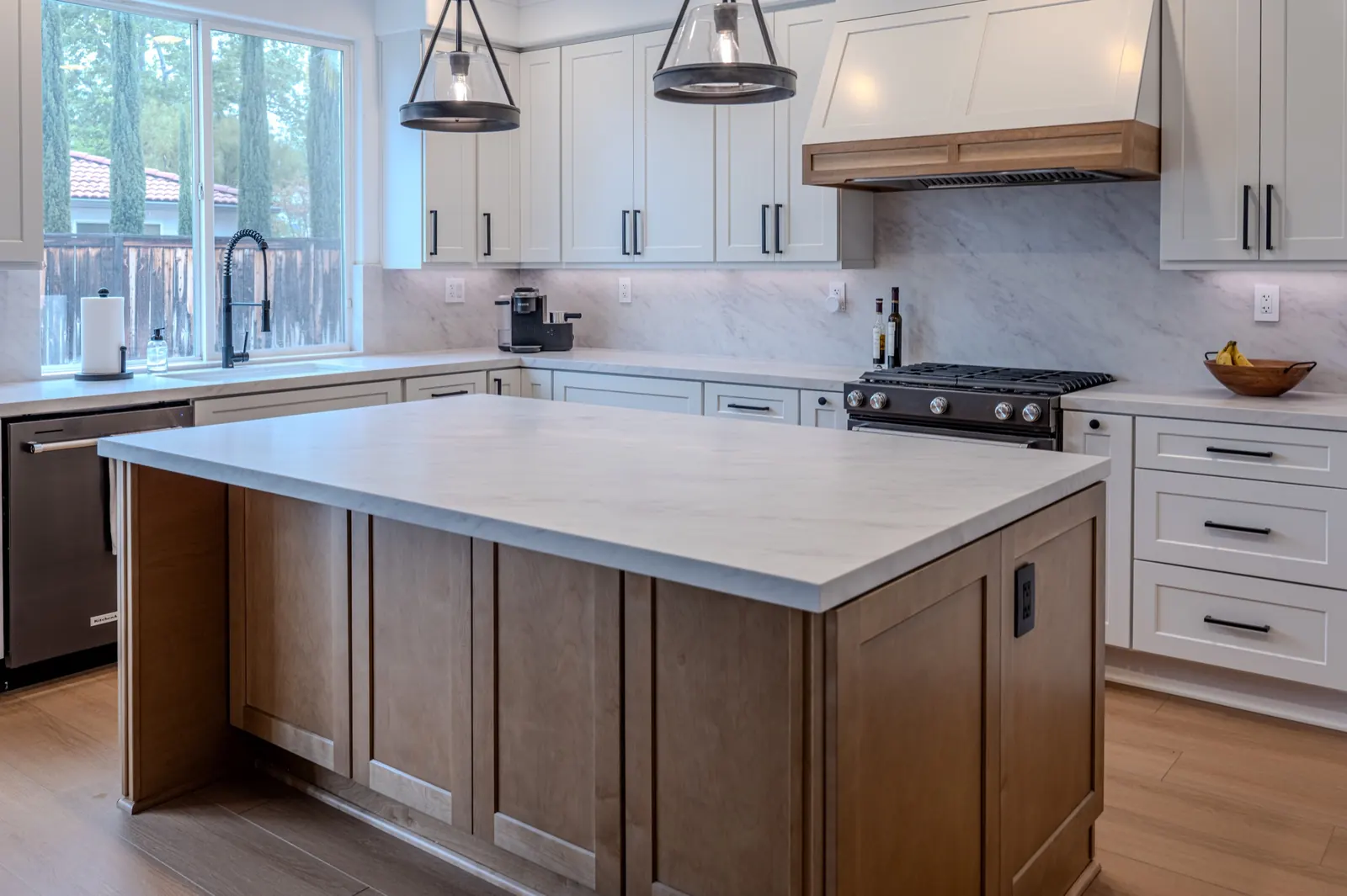 White shaker kitchen with custom wood island