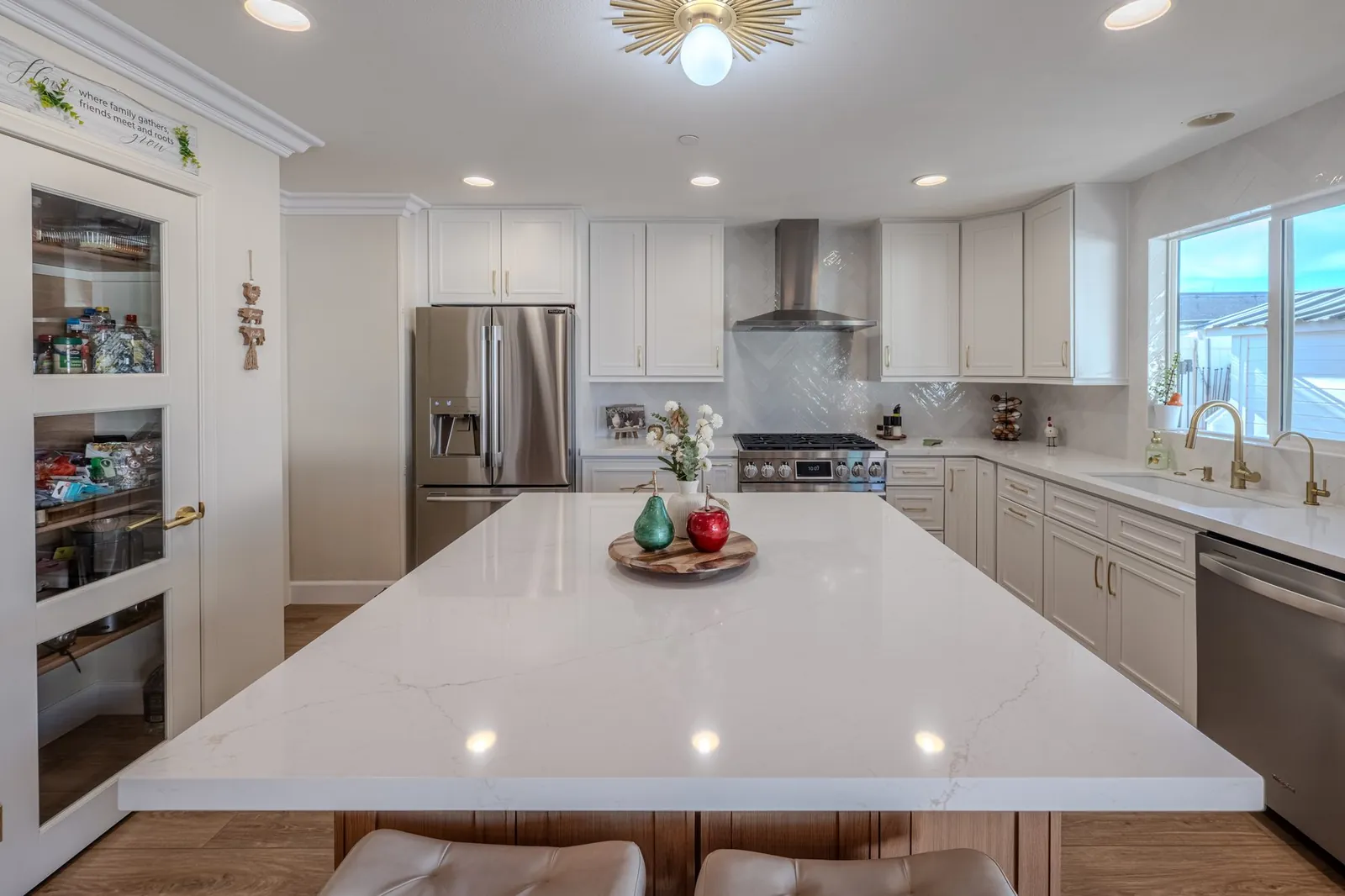 White countertops with mixed oak and white kitchen cabinetry