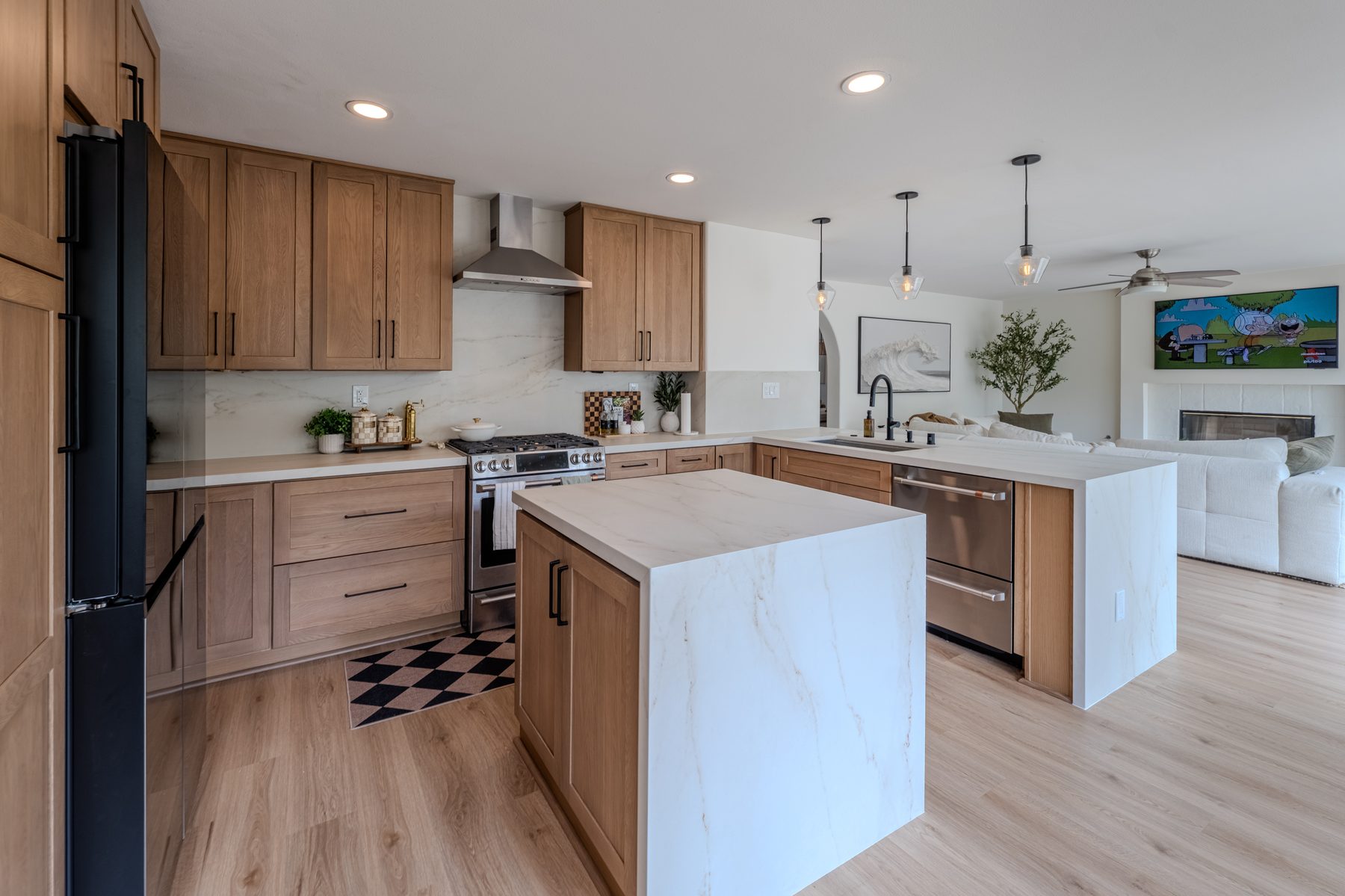 Oak kitchen remodel with waterfall-edge quartz island